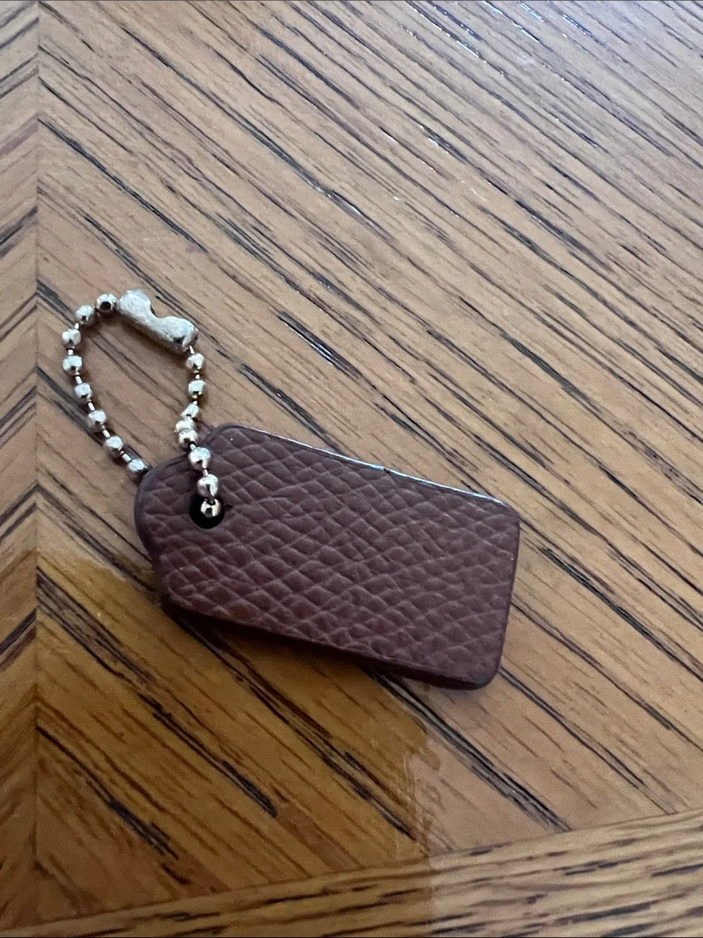 Coach Brown Pebbled Leather Key Tag with gold Bead Chain